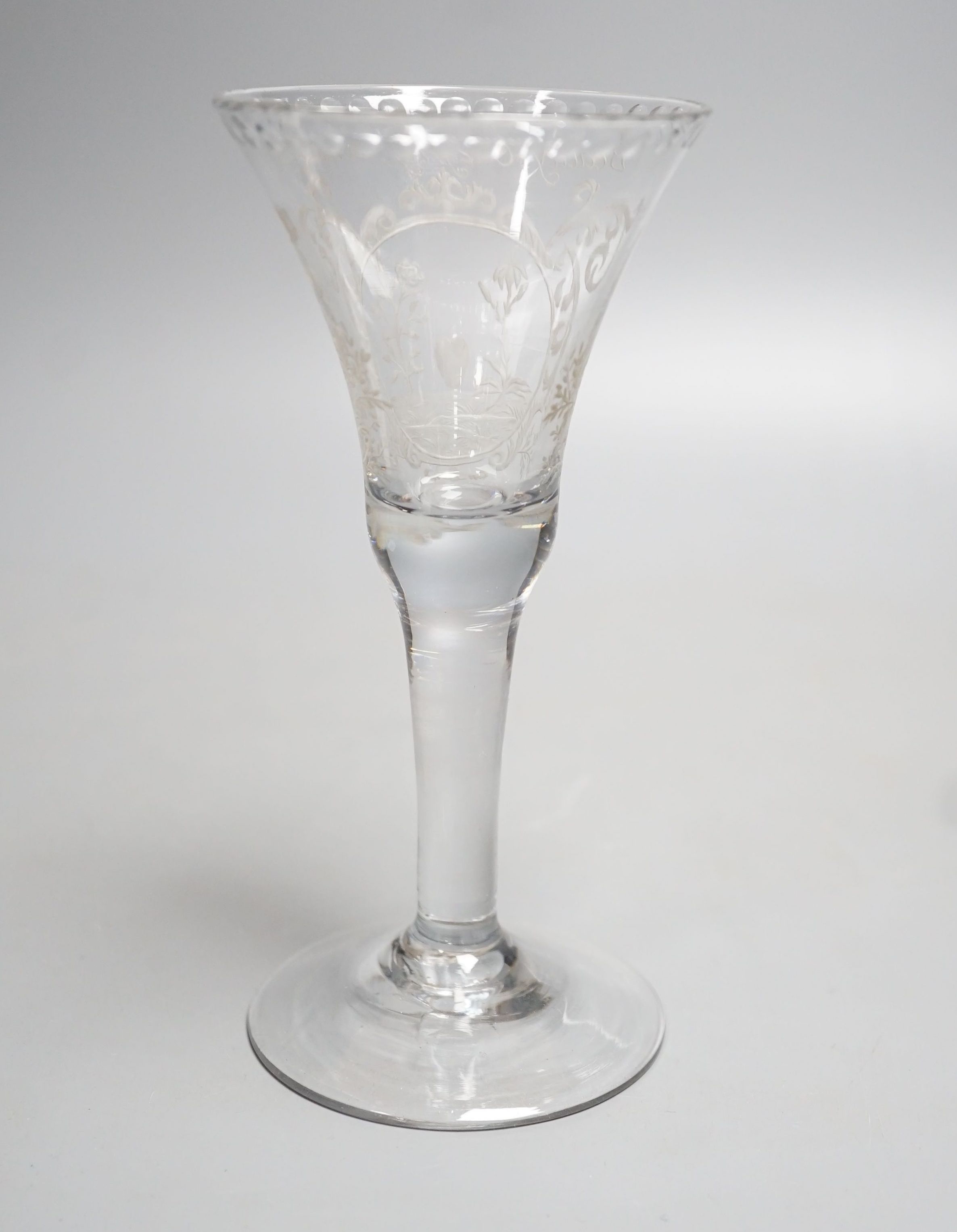 A Georgian wine glass, possibly later engraved ‘Beauty, Chastity, and Love above a lily, heart and rose. 16cm